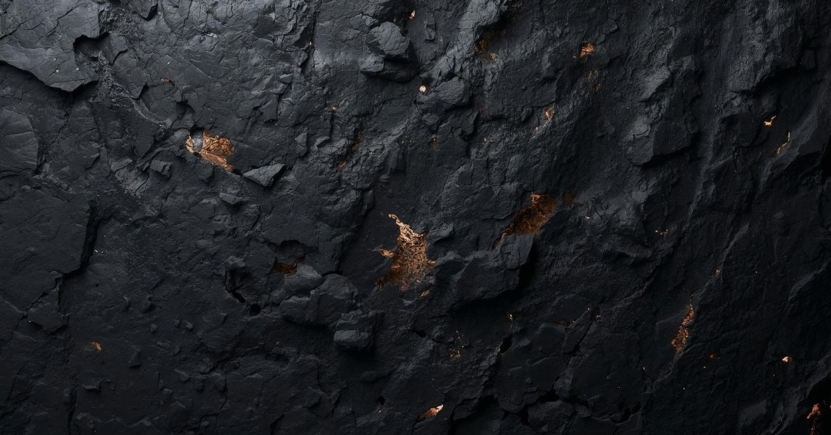 Dark fractured surface with subtle golden light emerging through cracks, symbolizing hidden inner truth becoming visible.